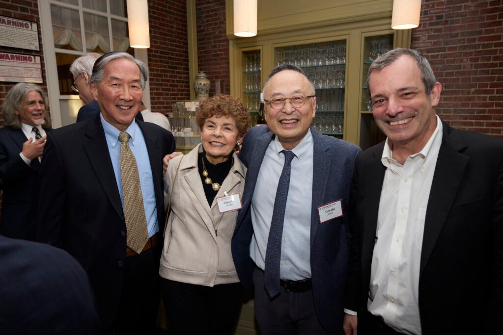 A group of four gusts pose together, with Gerald Chan second from right. 