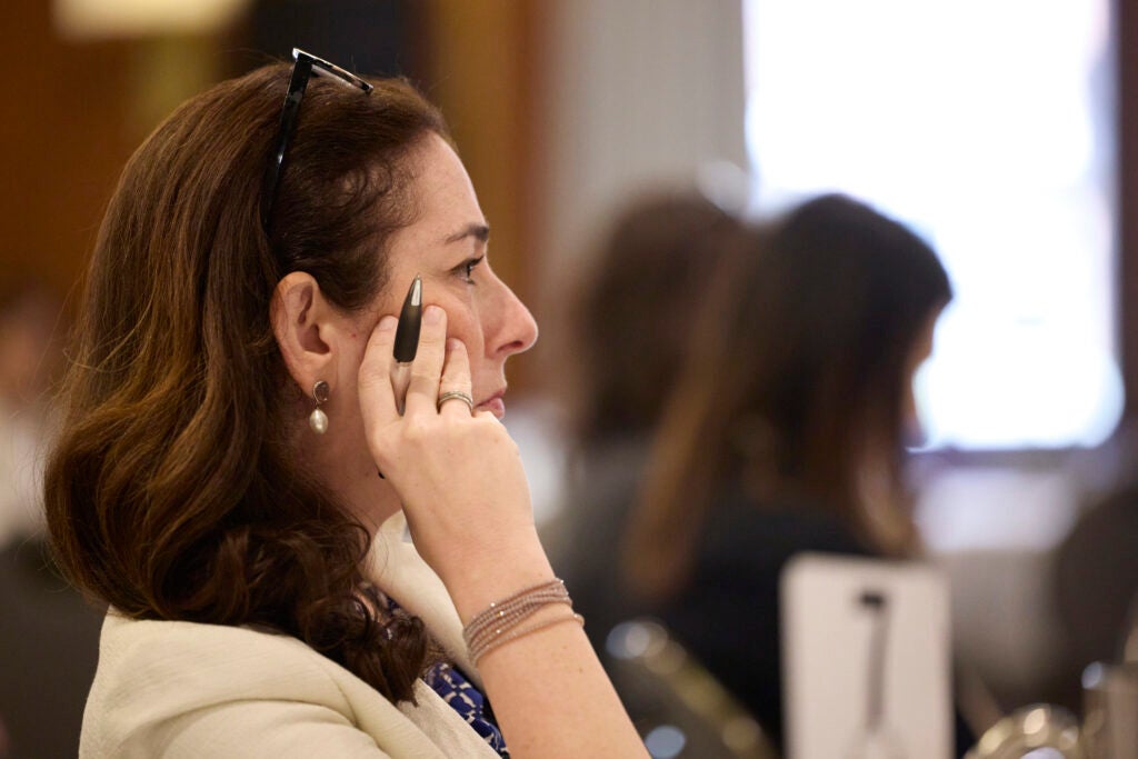 Profile of a woman listening attentively. 