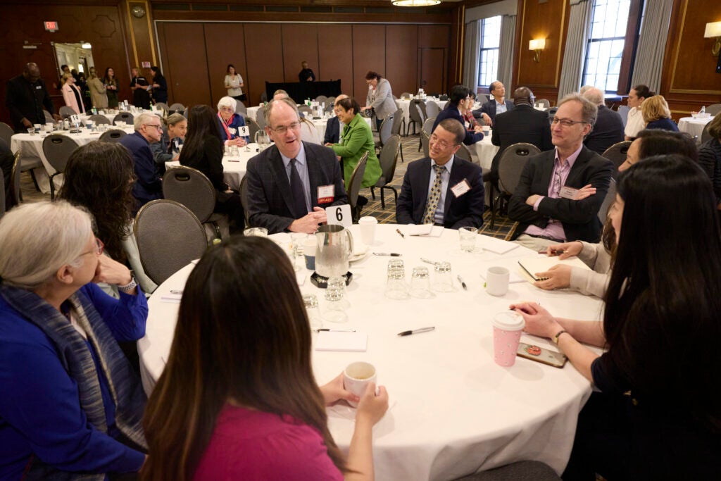View of a full table engaged in conversation. 