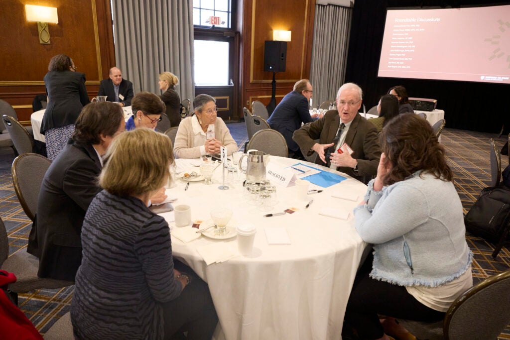 View of a full table engaged in conversation. 