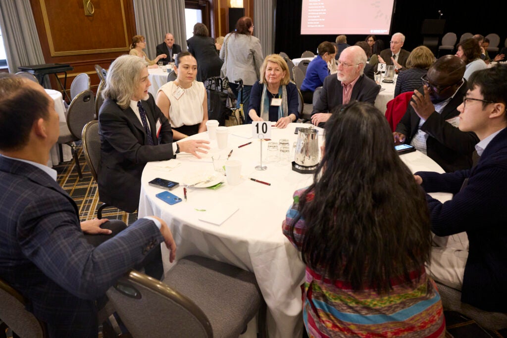 View of a full table engaged in conversation. 