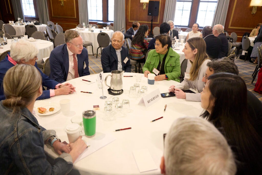 View of a full table engaged in conversation. 