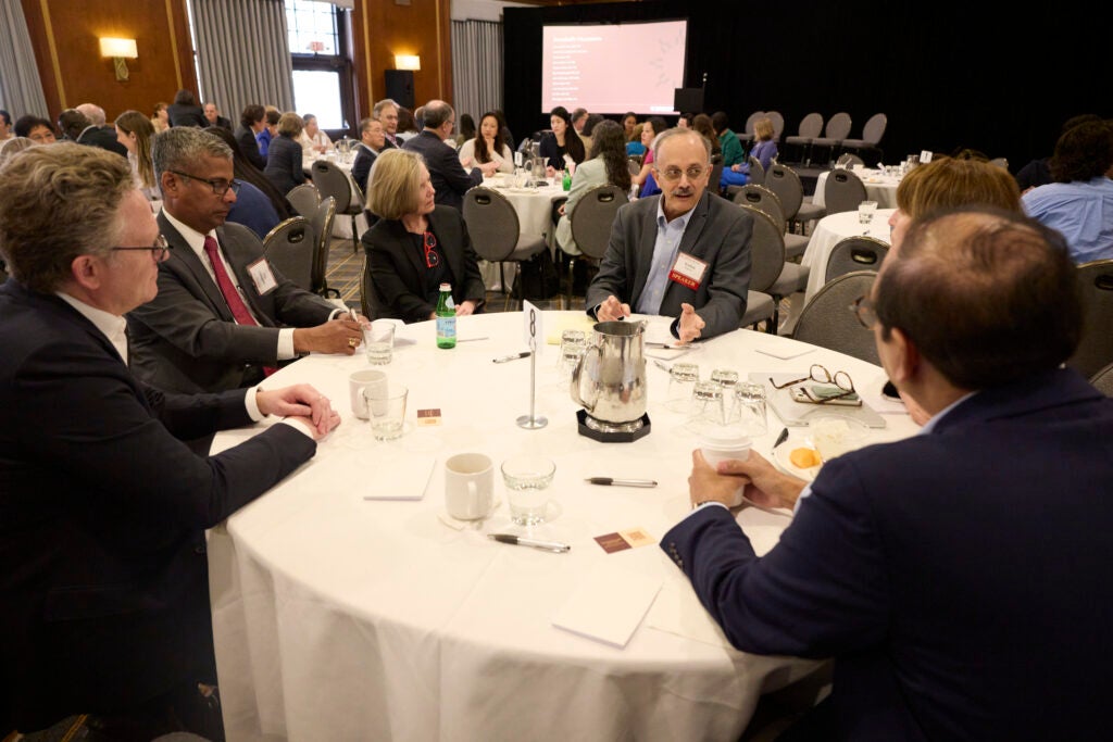 View of a full table engaged in conversation. 