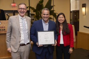 Harvard Hero award winner Henrique Coelho with Deans Baccarelli and Kim