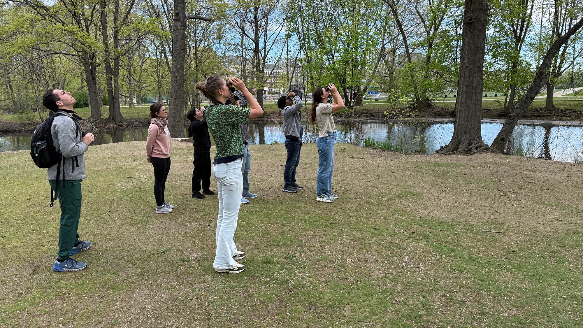 Students point their binoculars skyward during a recent birding outing.