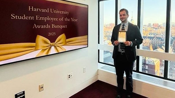 Connor Kubeisy holding an award certificate