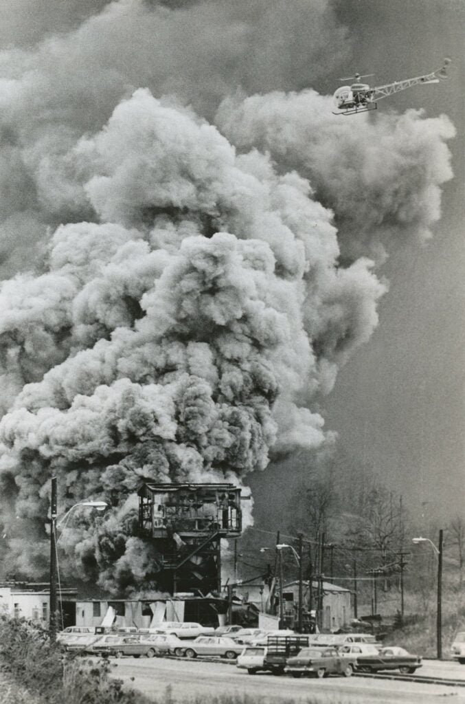 Black and white photo of dust billowing out of a coal mine. Farmington mine disaster, November 20, 1968.