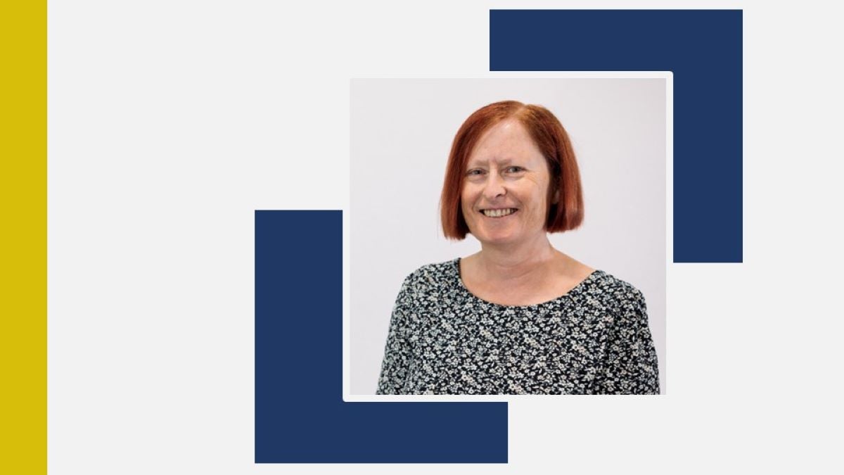 Headshot of Susan Chilton on white background with dark blue and gold elements