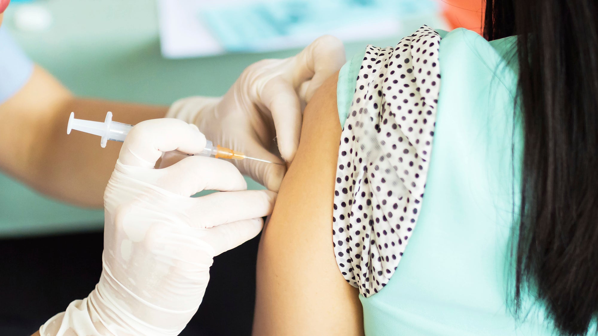 Young girl receiving a vaccine