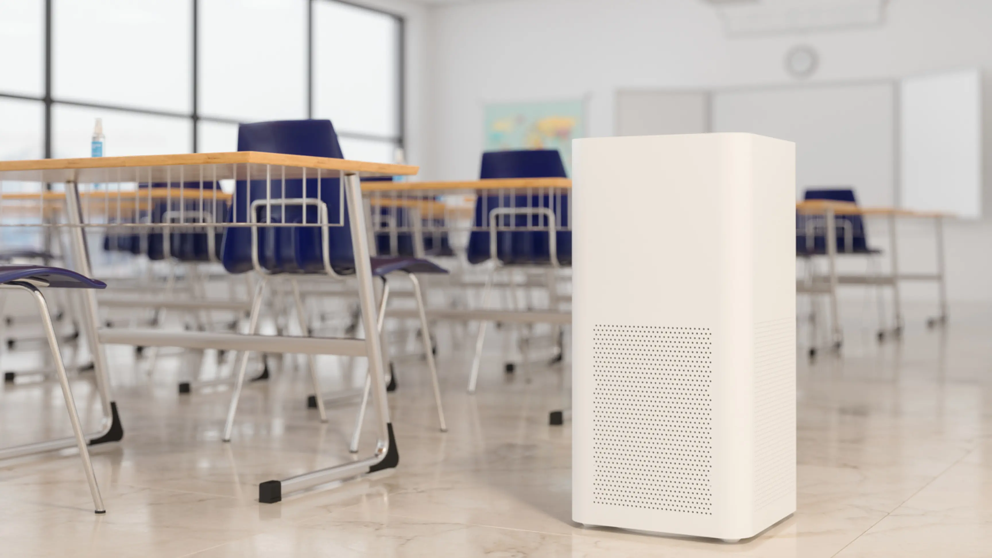 Photo of an empty school classroom with an air purifier.