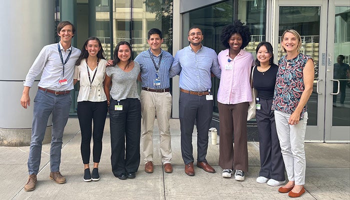 Research team smiling outside