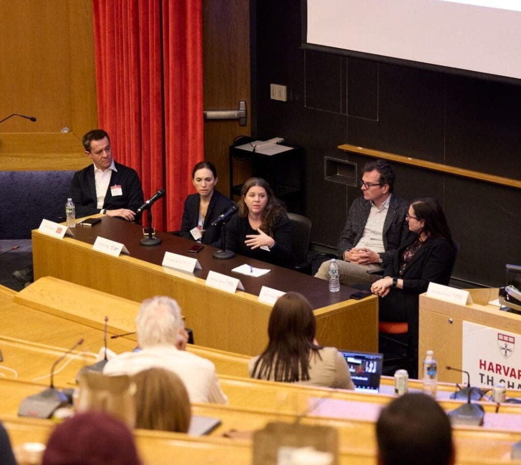 Katherine Keyes answers a question during symposium panel discussion.
