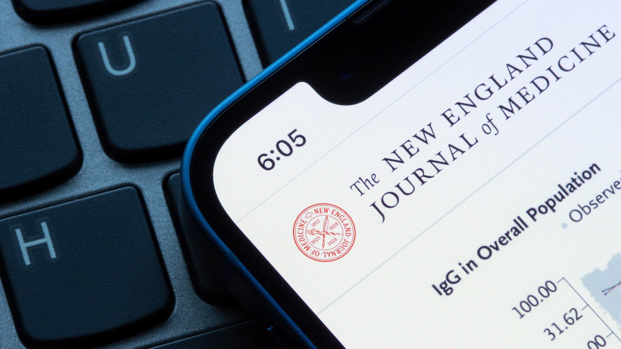 Closeup of the homepage of the New England Journal of Medicine, a peer-reviewed medical journal published by the Massachusetts Medical Society, seen on an iPhone.
