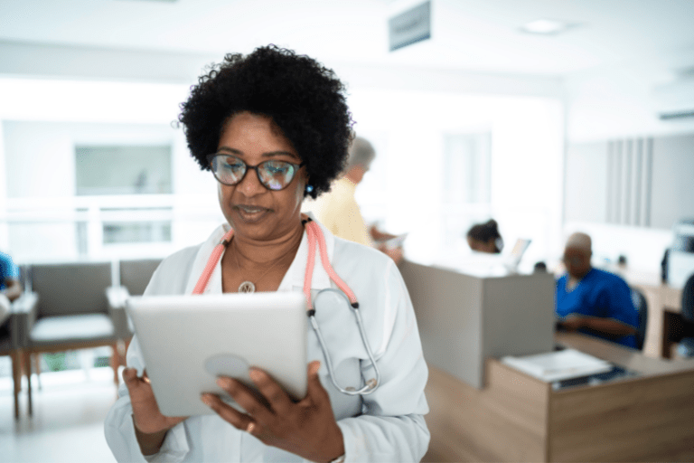 Hospital worker reviewing paperwork intently
