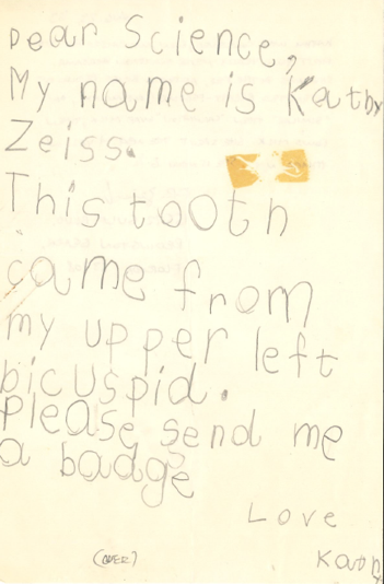 A handwritten letter that reads, "Dear Science, My name is Kathy. This tooth came from my upper left bicuspid. Please send me a badge. Love, Kathy."
