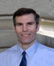 Headshot of Joseph Rhatigan, smiling
