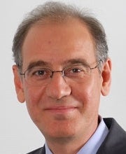 Headshot of Rifat Atun, smiling