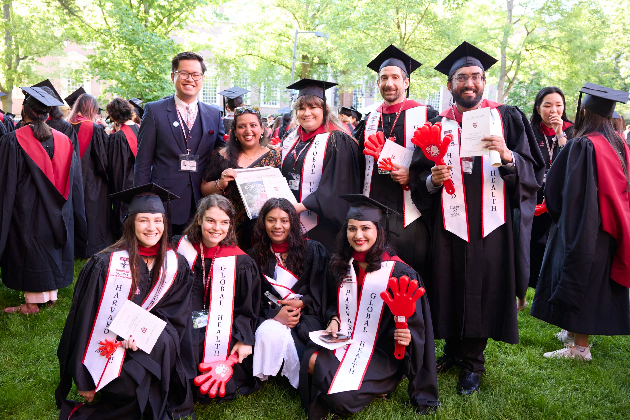 MPH students pose in their graduation regalia.