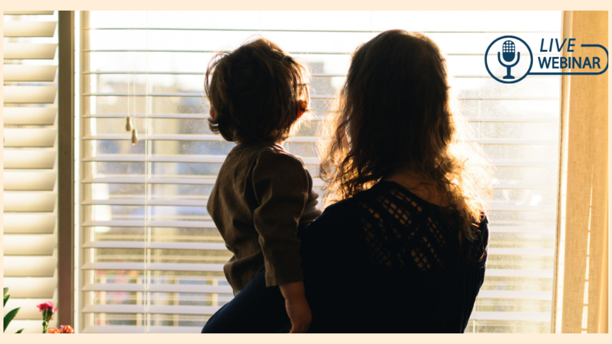 picture of mother holding her child from looking out at window, photo taken from back of people