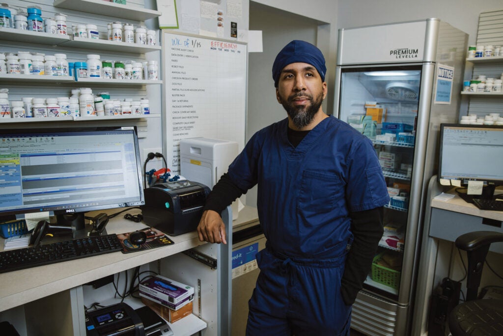 Eugenio Fernandez in his pharmacy.