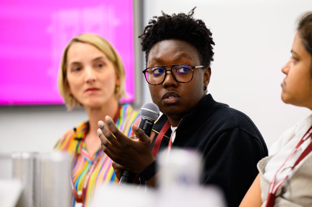 Zoe Davis speaks into microphone.