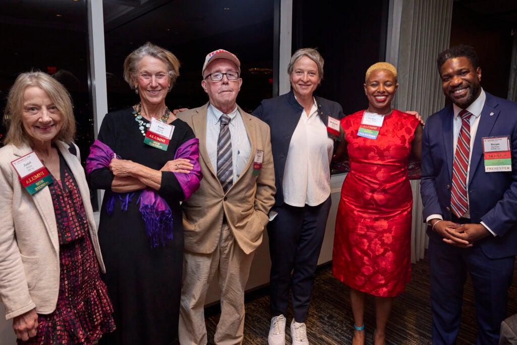 A group of alumni celebrating different reunion years. 