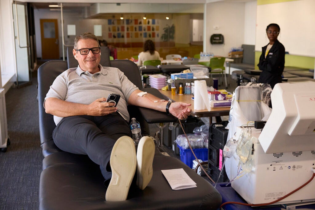Paul Martin, director of administration for the Department of Global Health and Population, donates blood.