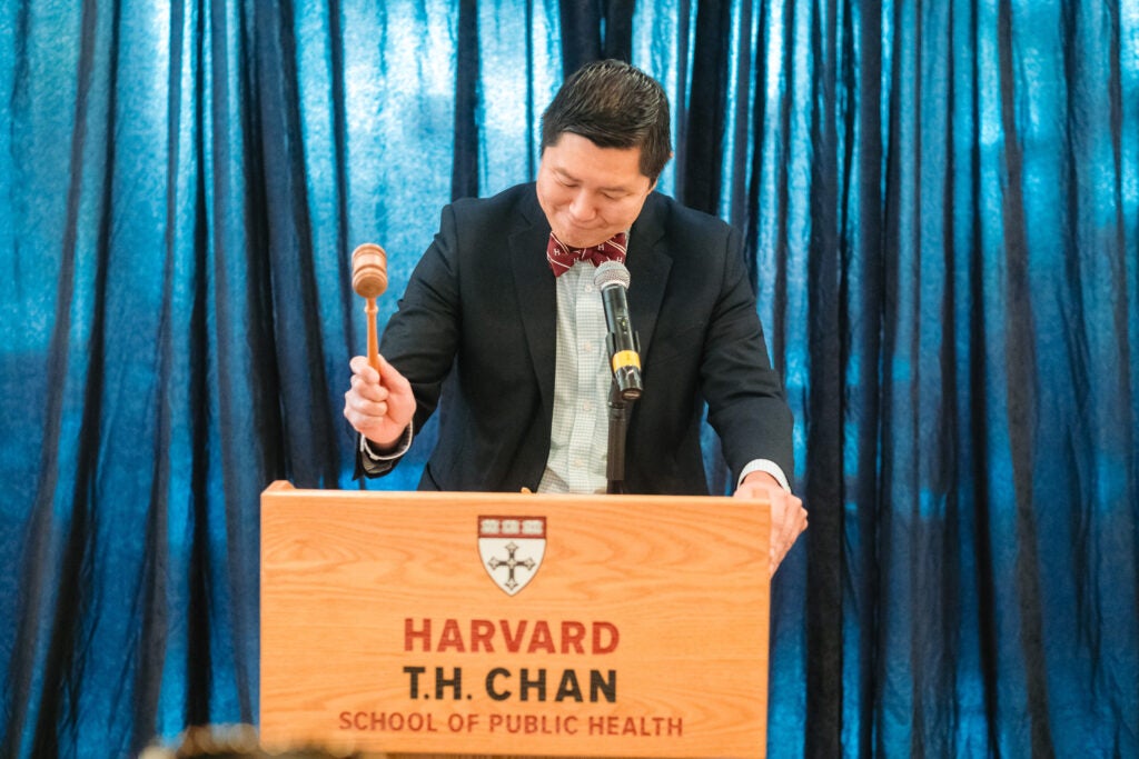 Incoming President Bernie Lee signals taps his gavel to signal the conclusion of a vote.