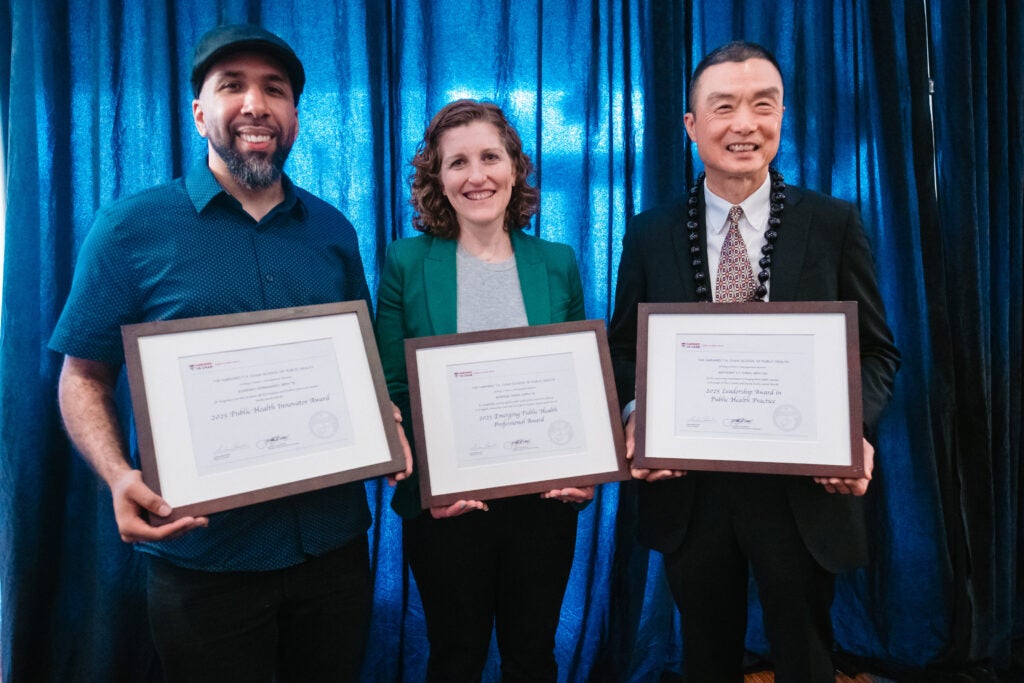 Professional Award winners Eugenio Fernandez, Morissa Henn, and Anthony Chen pose with their award citations. 