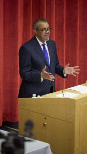 Dr. Tedros Adhanom Ghebreyesus speaking at a podium