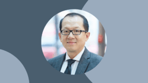 Qi Sun headshot on slate blue background in circle frame