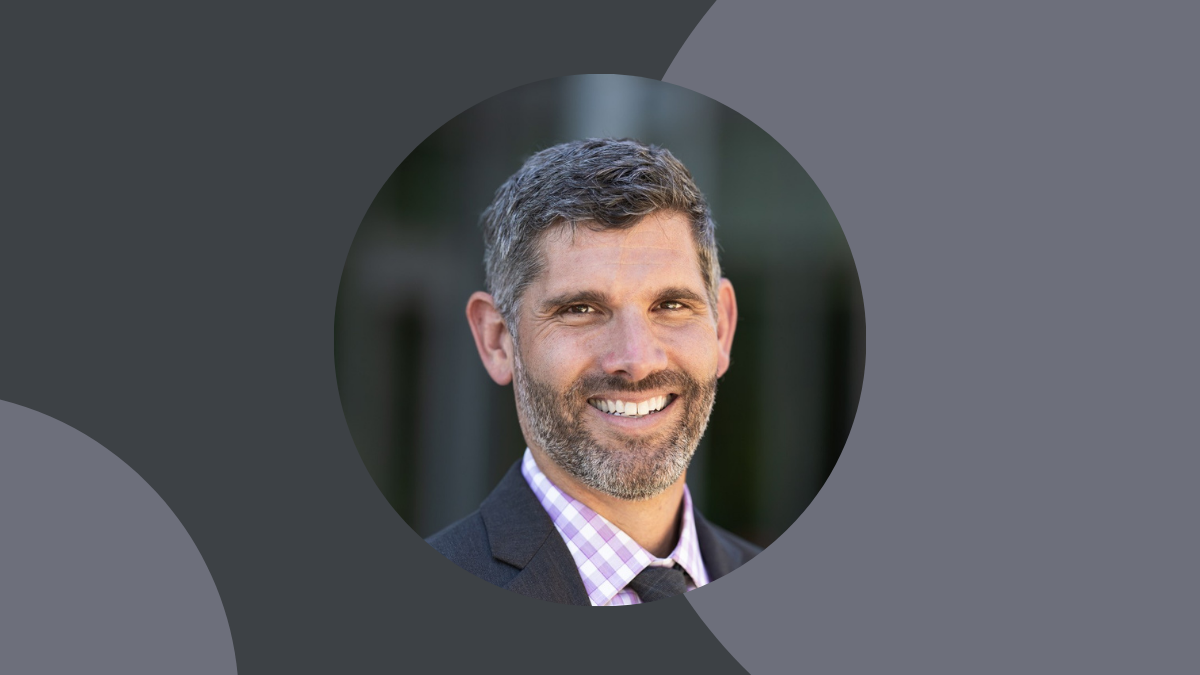 Gray visual with headshot of Dr. Edward Spang