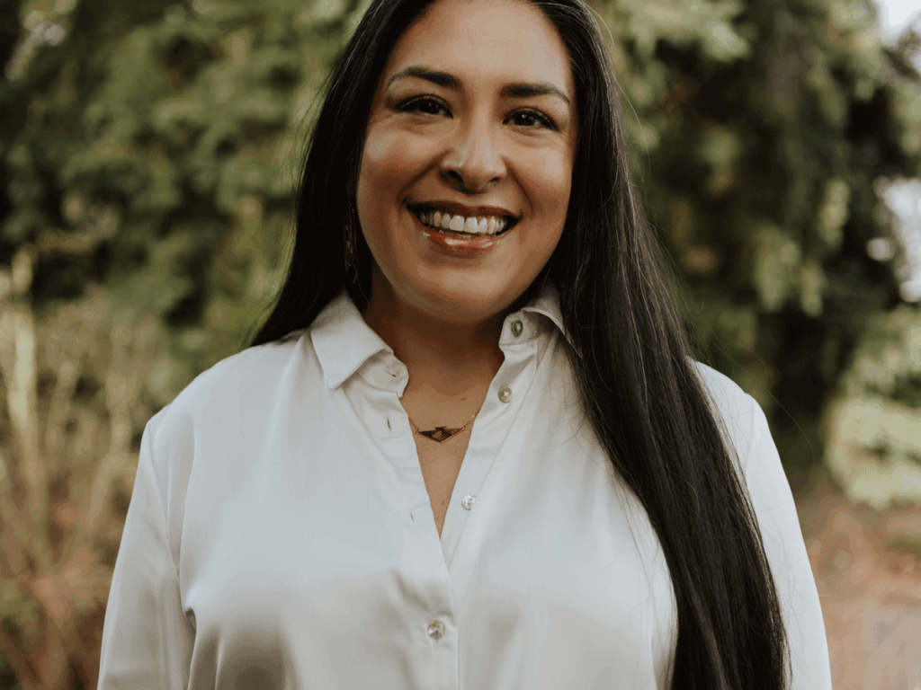 colleen echohawk smiling and looking at the camera