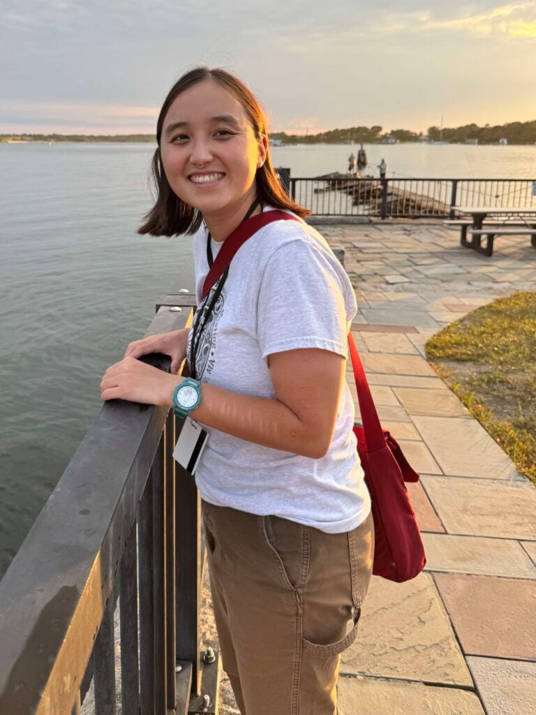 Esrah Du by the water at sunset