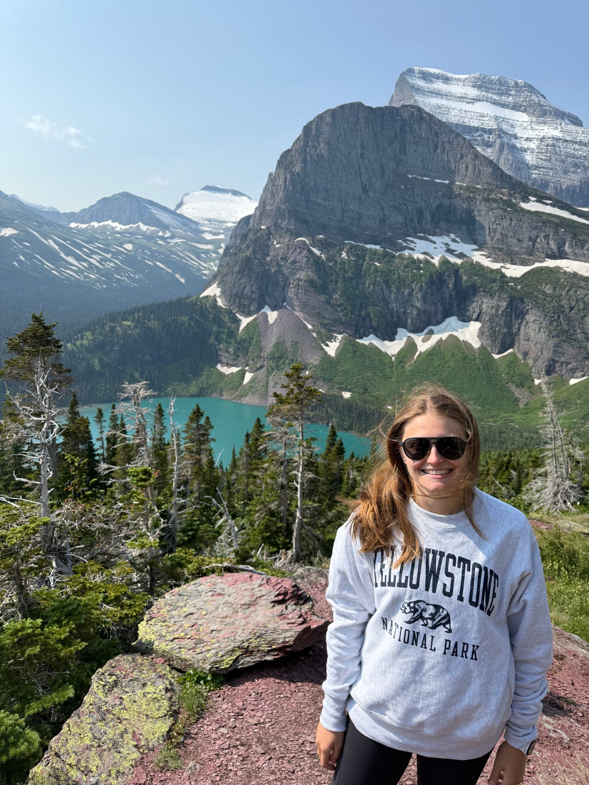 Hannah Matthews at the top of a hike in Glacier National Park.