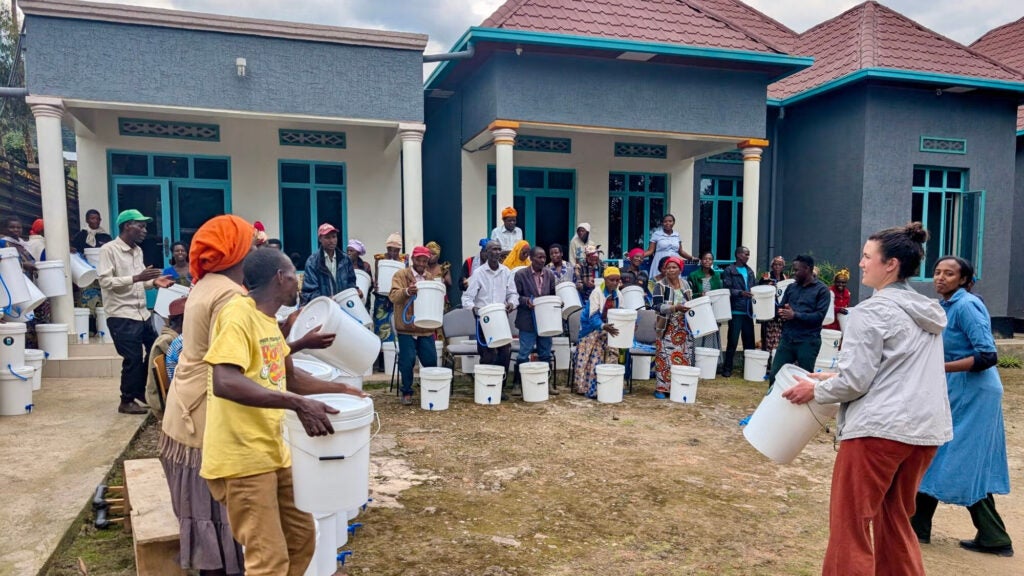People holding buckets