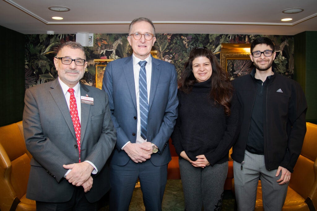 Dr. Massoud and Dean Baccarelli pose for a photo with two guests. 