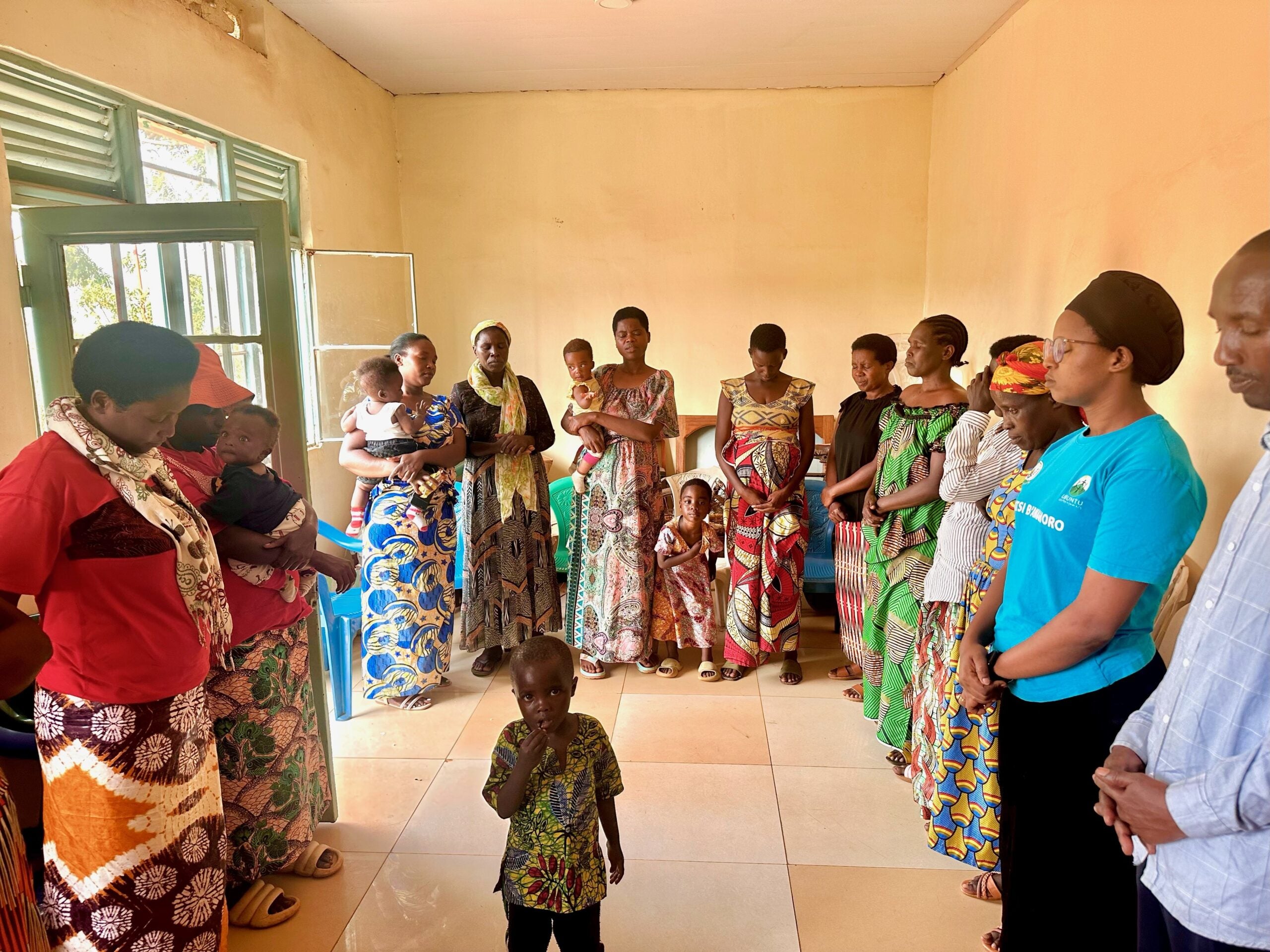 Participants in a community healing circle facilitated by a Community Healing Assistant (CHA)
