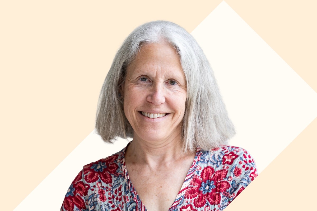 Headshot of Gabriella Stern against a cream and tan background.
