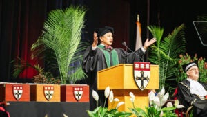 Bernard Lee speaking at podium
