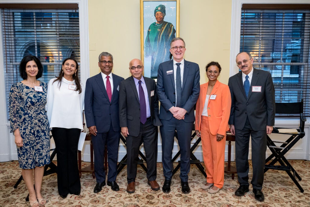 All event speakers pose standing; from right to left: Sheila Sarma, Padmini Sekhsaria, moderator Anthony Dias, Vish Viswanath, Dean Andrea Baccarelli, Shruthi Mahalingaiah, and Wafaie Fawzi.