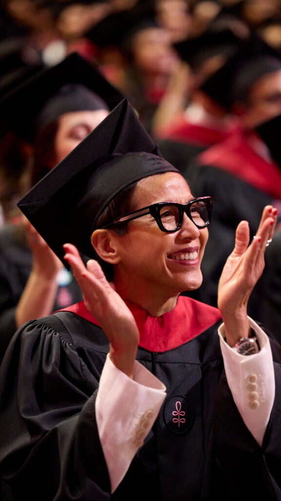 A graduate applauds