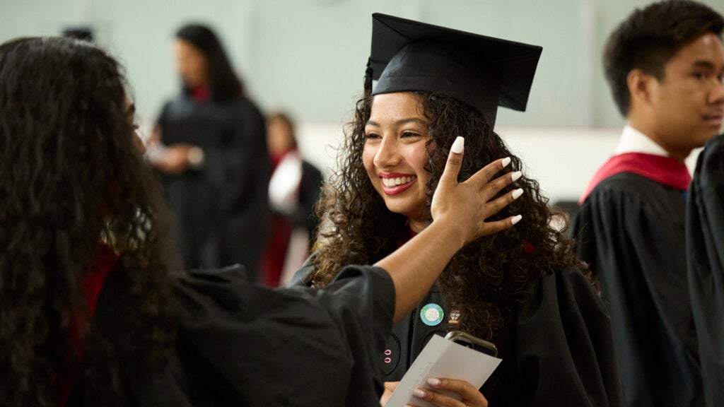 A graduate receives a hug
