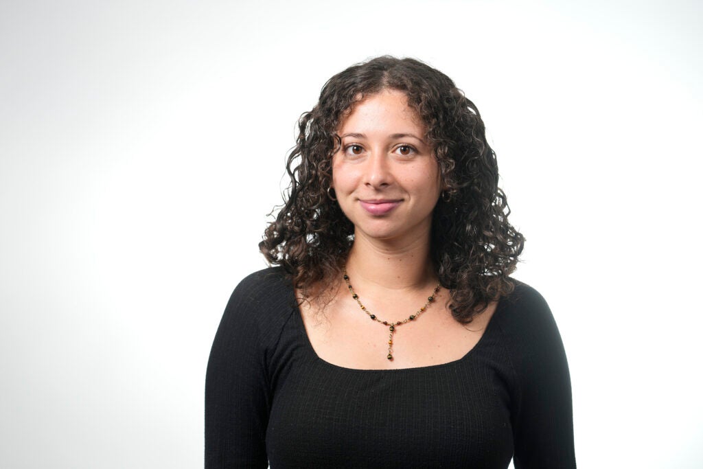Headshot of Hannah Kaufman in a black shirt.
