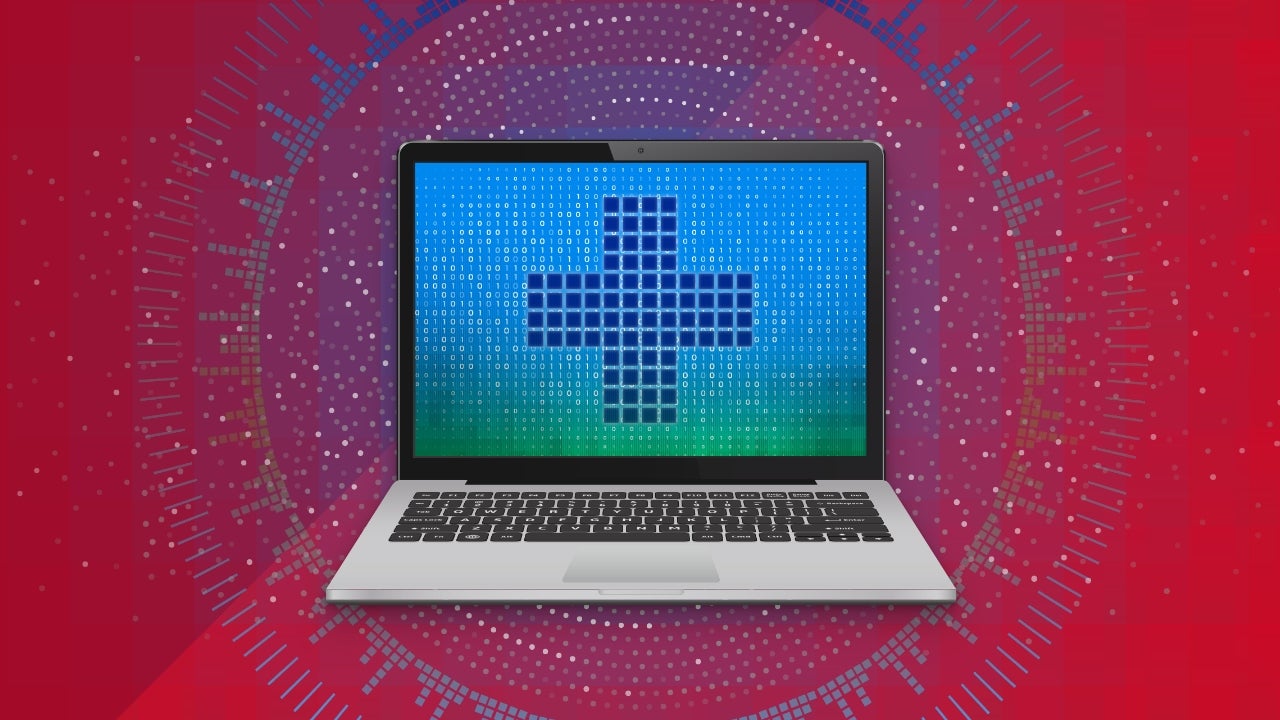 Image of a laptop displaying a medical cross on a blue, green background