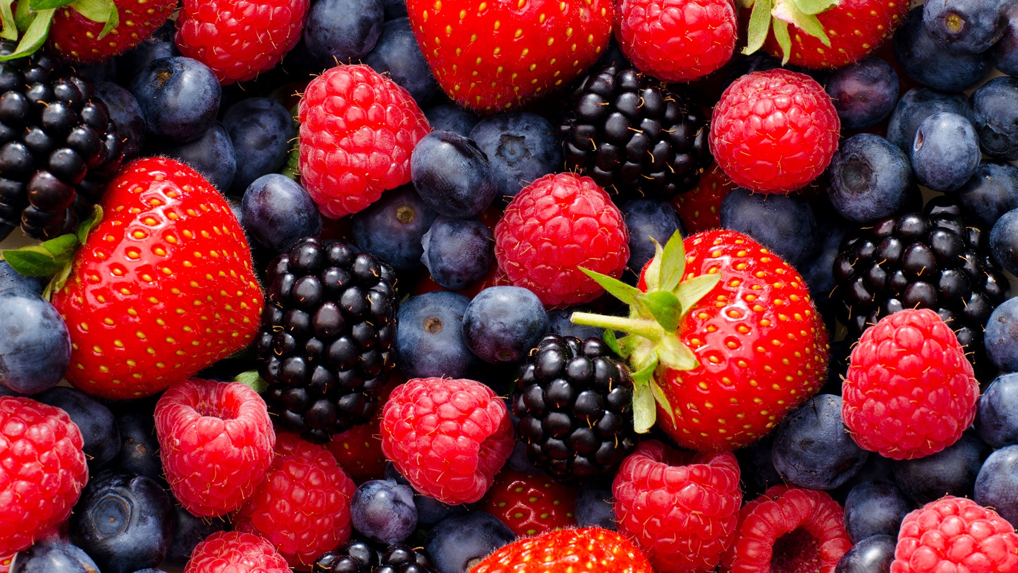 Close-up shot of strawberries, blueberries, blackberries and raspberries