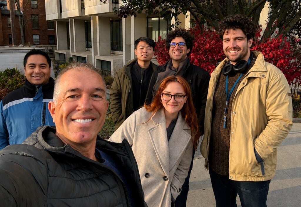 Le Pen group taking a selfie outside the Countway library.