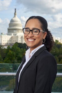 Adriana Tejada poses in front of the Massachusetts State House