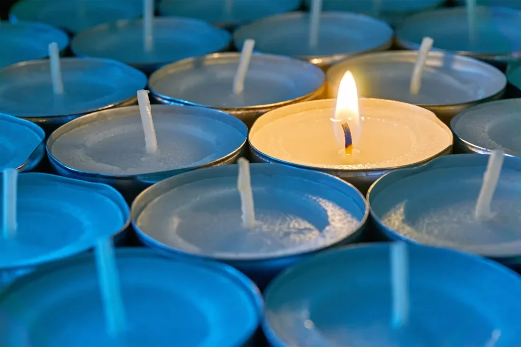 Candles, with one lit in the middle