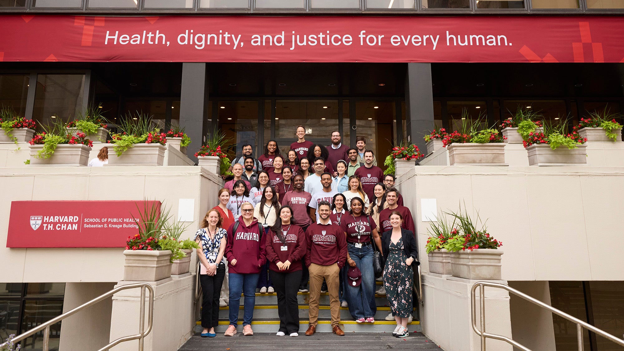 MPH-EPI students pose for a group photo on the steps of the Kresge building. Photographed on the Chan campus, June 28, 2026. By Kent Dayton.